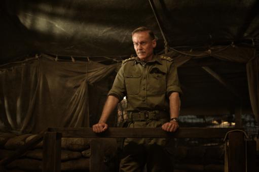 Man standing in a war zone