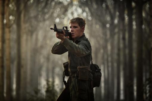 Man shooting in the trees